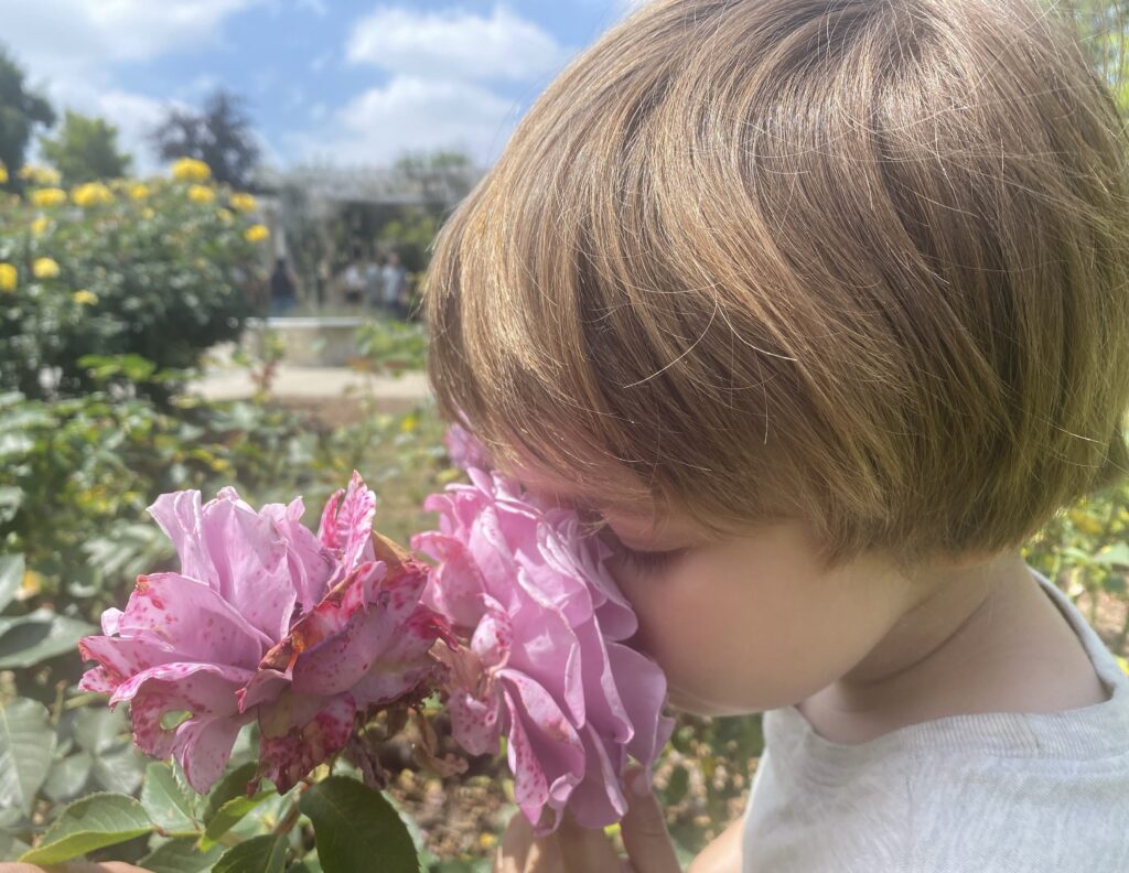 Barbara's grandchild with a flower