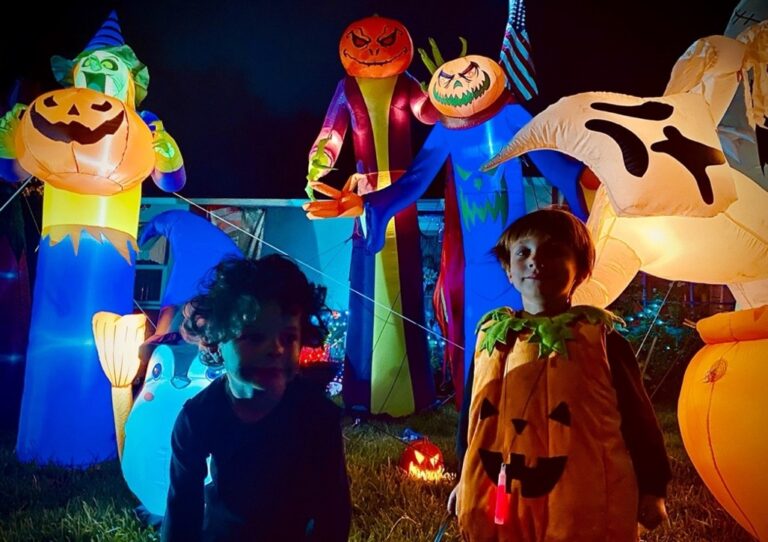 Grandchildren surrounded by Halloween decor